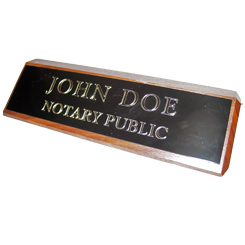 This elegant, genuine Oklahoma notary walnut desk, sign is made of solid wood and engraved on a metal plate with gold lettering with your notary name and the wording 'Notary Public'. It makes a fine addition to any desk or office. This sign can be customized with up to two lines.